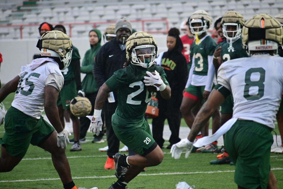 Florida A&M running back Levontai Summersett (with ball) goes through drills during the first spring football practice at Ken Riley Field at Bragg Memorial Stadium, Tuesday, March 5, 2024.