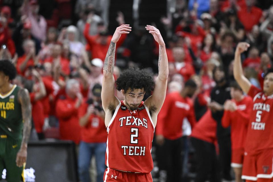 Texas Tech guard Pop Isaacs (2) encourages the crowd during the second half of an NCAA college basketball game against Baylor Saturday, March 9, 2024, in Lubbock, Texas. (AP Photo/Justin Rex)