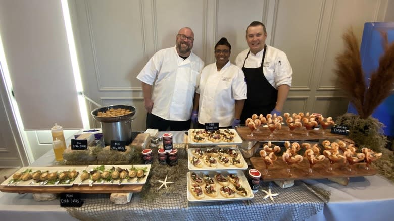 staff with seafood buffet