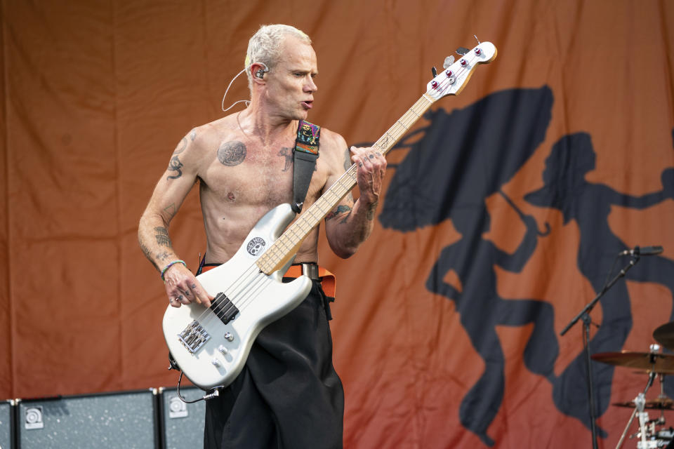 Flea of the Red Hot Chili Peppers performs at the New Orleans Jazz and Heritage Festival, on Sunday, May 1, 2022, in New Orleans. (Photo by Amy Harris/Invision/AP)