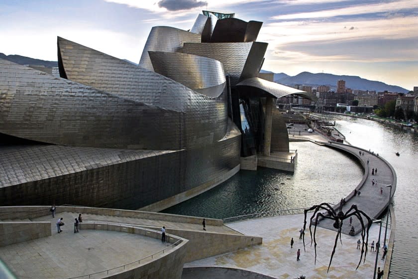 The Guggenheim Museum is situated next to the River Nervion in Bilbao, Spain.