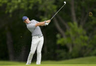 Rory McIlroy, of Northern Ireland, hits his approach shot on the 18th hole during round three of the Canadian Open golf tournament at St. George's Golf and Country Club in Toronto, Saturday, June 11, 2022. (Nathan Denette/The Canadian Press via AP)