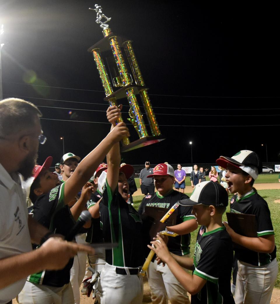 Mattingly Landscape celebrates after pulling out a 6-5 win in the bottom of the sixth inning against North Newark Little League rival Edward Jones, winning the Varsity Division championship in the 77th Licking County Shrine Tournament at Mound City.