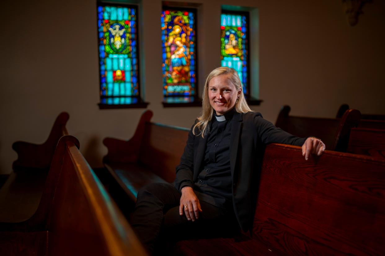 The Rev. Sarah Smith stands in the sanctuary of St. Paul's Episcopal Cathedral, where she is associate priest.