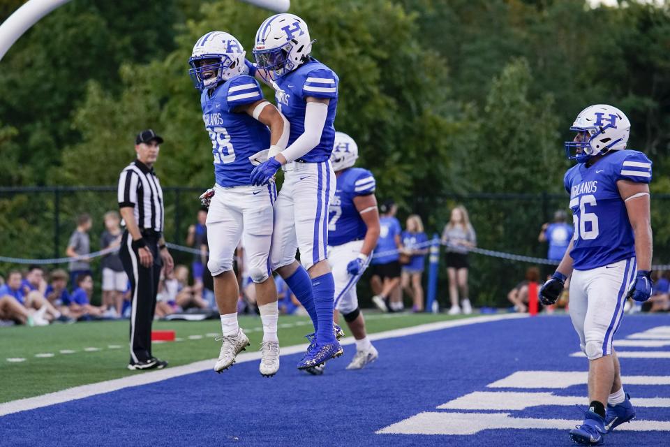 Highlands' running back Dawson Hosea (28) celebrates with Charlie Noon after scoring a touchdown during a KHSAA high school football game against the Simon Kenton Pioneers at Highlands High School Friday, Aug. 26, 2022.