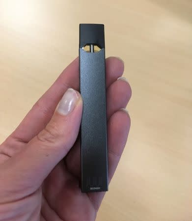 FILE PHOTO: Juul e-cigarette is seen in this picture illustration taken July 16, 2018. REUTERS/Martinne Geller/Illustration/File Photo