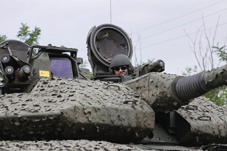 A Ukrainian soldier on a Swedish CV90 infantry fighting vehicle at his positions near Bakhmut, Donetsk region, Ukraine, Sunday, June 25, 2023. (Roman Chop via AP)