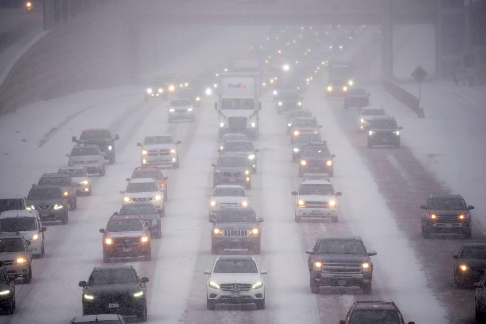 Rush hour traffic travels southbound on Interstate 35W in Minneapolis as a winter storm hit the Twin Cities Tuesday, Feb. 21, 2023. A monster winter storm took aim at the Upper Midwest on Tuesday, threatening to bring blizzard conditions, bitterly cold temperatures and 2 feet of snow in a three-day onslaught that could affect more than 40 million Americans.