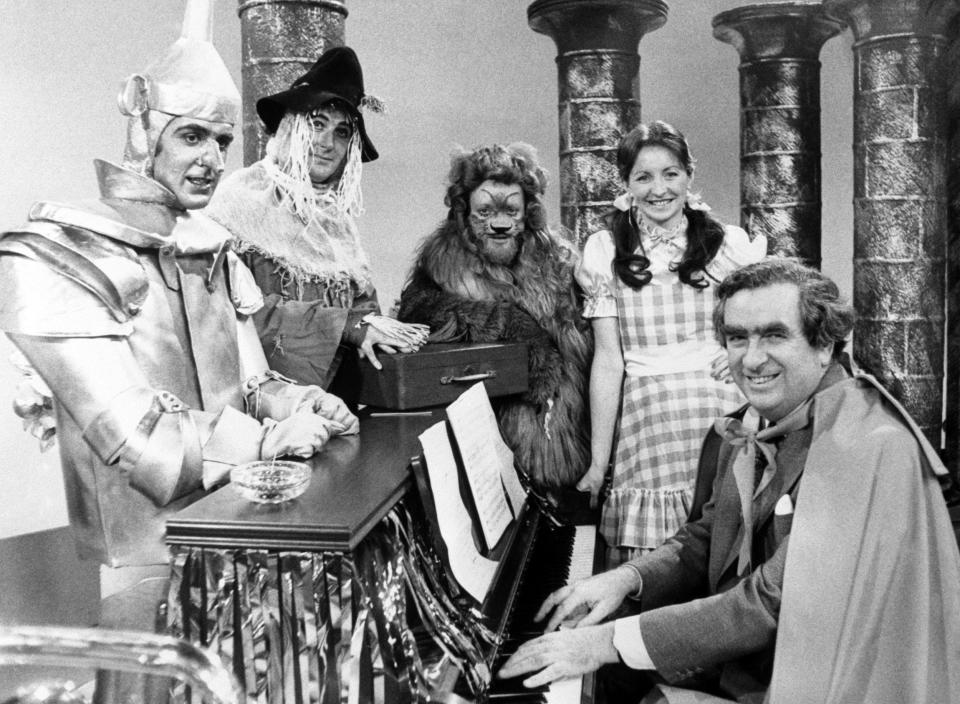 The Chancellor Denis Healey joins the Nationwide team for their version of The Wizard of Oz in 1977, with, from the left, John Stapleton as the Tin Man, Wellings as the Straw Man, Richard Stilgoe as the Lion and Sue Lawley as Dorothy - PA/Alamy