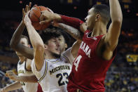 Michigan forward Brandon Johns Jr. (23) is defended by Indiana forward Trayce Jackson-Davis (4) during the second half of an NCAA college basketball game, Sunday, Feb. 16, 2020, in Ann Arbor, Mich. (AP Photo/Carlos Osorio)