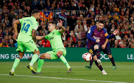 Soccer Football - La Liga Santander - FC Barcelona v Levante - Camp Nou, Barcelona, Spain - April 27, 2019 Barcelona's Lionel Messi scores their first goal REUTERS/Albert Gea
