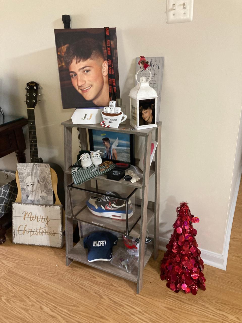 A shelf in Tanya Niederman's Mantua home holds some of her son's belongings, including one of his favorite sneakers, his baby shoes, a baseball cap and photos. The 19-year-old died in February from a fentanyl overdose.