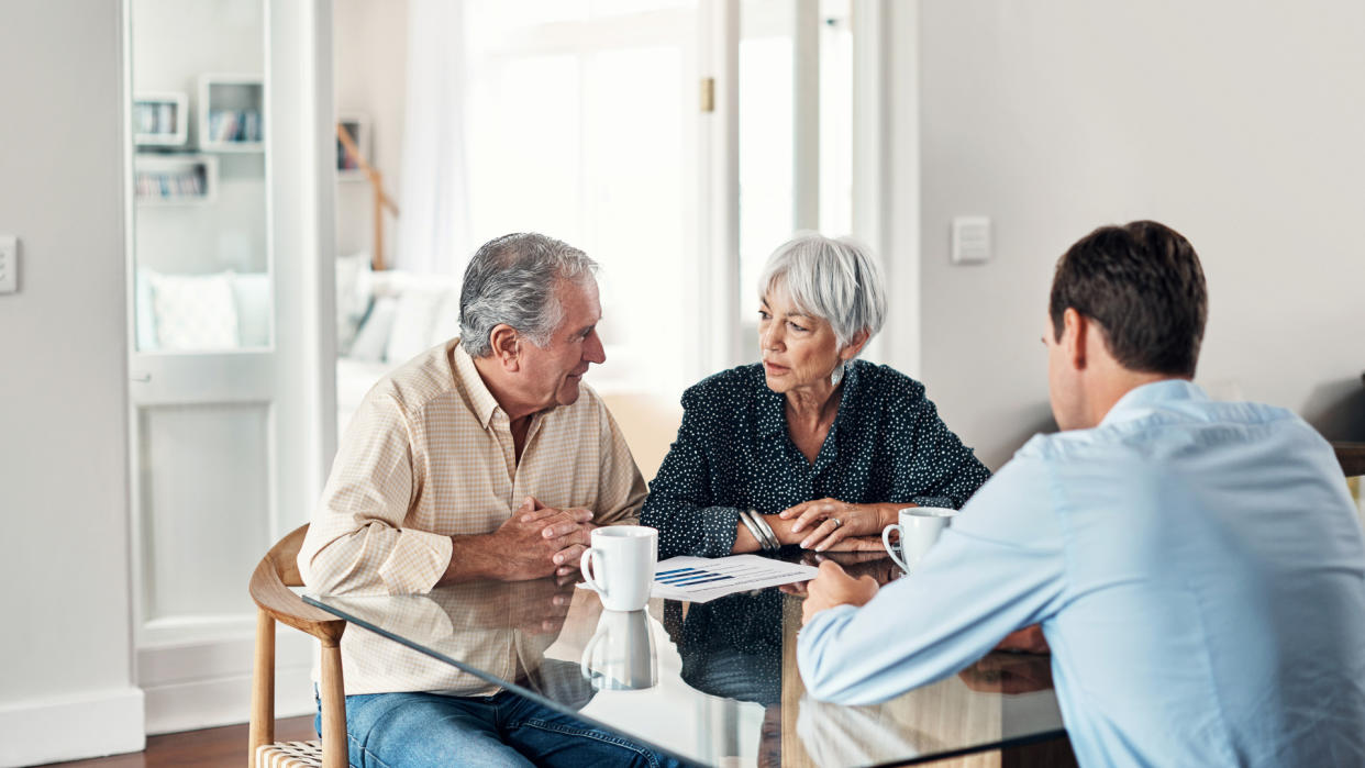 Shot of a senior couple getting advice from their financial consultant at home.