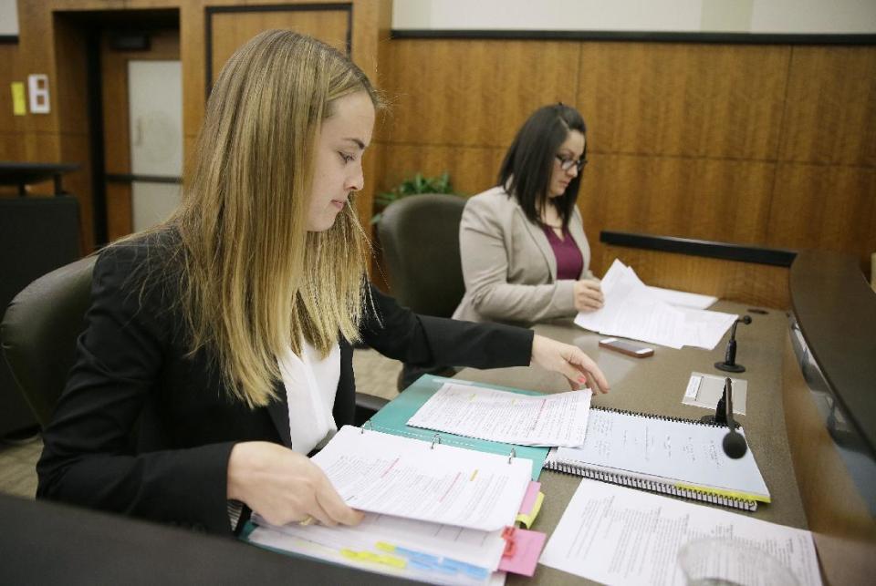 In this photo taken Monday, March 13, 2017, students Michelle Freeman, left, and Deborah Rodriguez, right, prepare to make arguments in a moot courtroom at the University of California, Hastings College of the Law in San Francisco. The students will have the opportunity to argue at the 9th Circuit, the nation's largest federal appeals court, under an unusual program that offers law schools the opportunity to take on appeals. Over the course of a year, students spend countless hours researching their cases and writing briefs. The experience culminates in a 15-minute presentation before a judicial panel. (AP Photo/Eric Risberg)