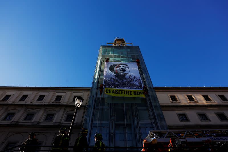 Greenpeace activists display illustration on Reina Sofia Museum in Madrid
