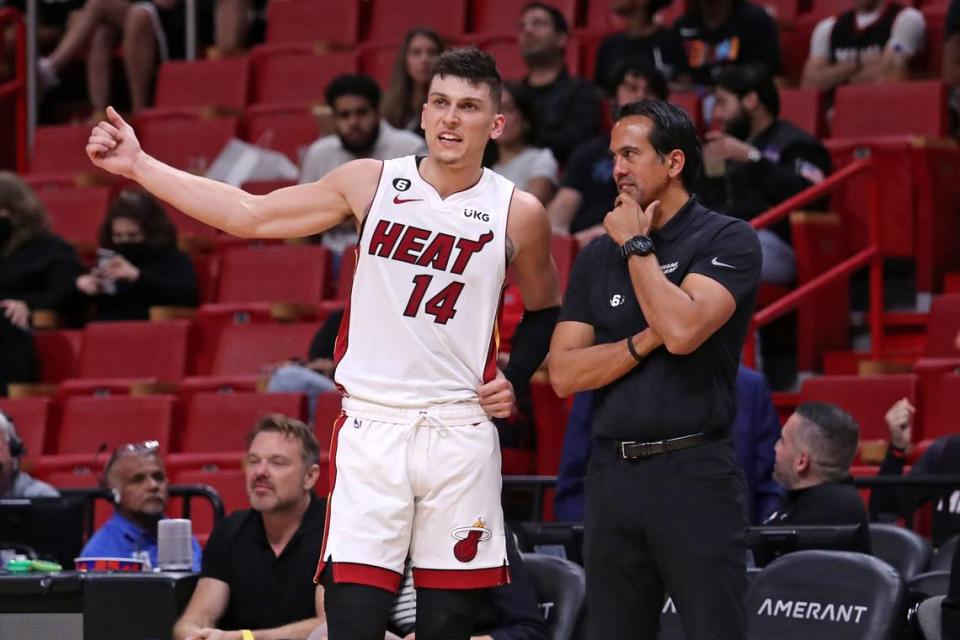 Miami Heat head coach Erik Spoelstra talks with guard Tyler Herro during a preseason game against the New Orleans Pelicans at FTX Arena on Oct. 12, 2022 in Miami. (John McCall/South Florida Sun Sentinel/TNS)