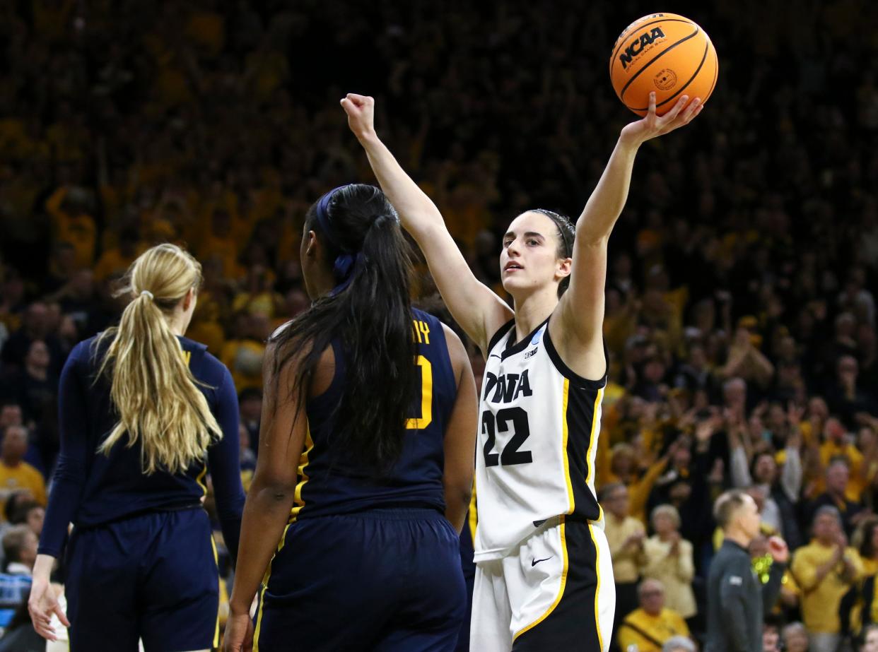 Guard Caitlin Clark #22 of the Iowa Hawkeyes celebrates as time runs out in the second half against the West Virginia Mountaineers during their second round match-up in the 2024 NCAA Division 1 Womens Basketball Championship at Carver-Hawkeye Arena on March 25, 2024 in Iowa City, Iowa.