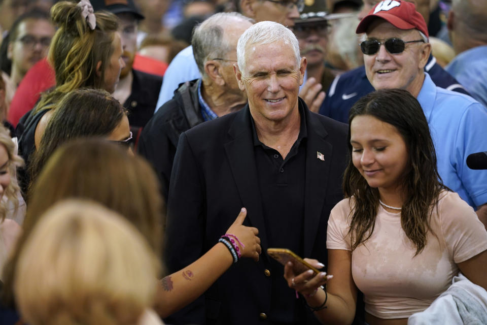 Former Vice President Mike Pence greets fairgoers during a visit to the Iowa State Fair, Friday, Aug. 19, 2022, in Des Moines, Iowa. (AP Photo/Charlie Neibergall)