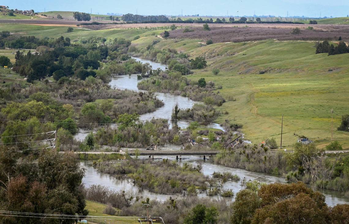 The San Joaquin River meanders past Friant as water is released from Friant Dam in excess of 8,000 cubic feet per second on Tuesday, April 11, 2023. Officials are expecting the massive Sierra Nevada snowpack will soon melt causing flooding issues downstream.