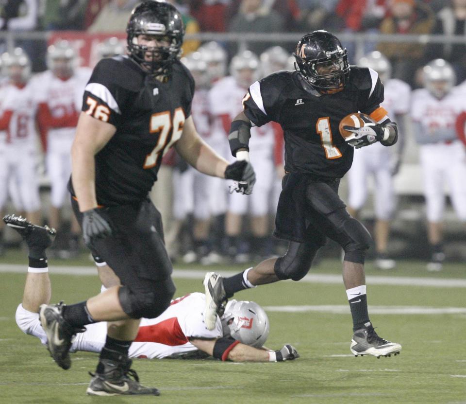 Marlington's Zach Higgins (left) leads Dymonte Thomas to a big gain