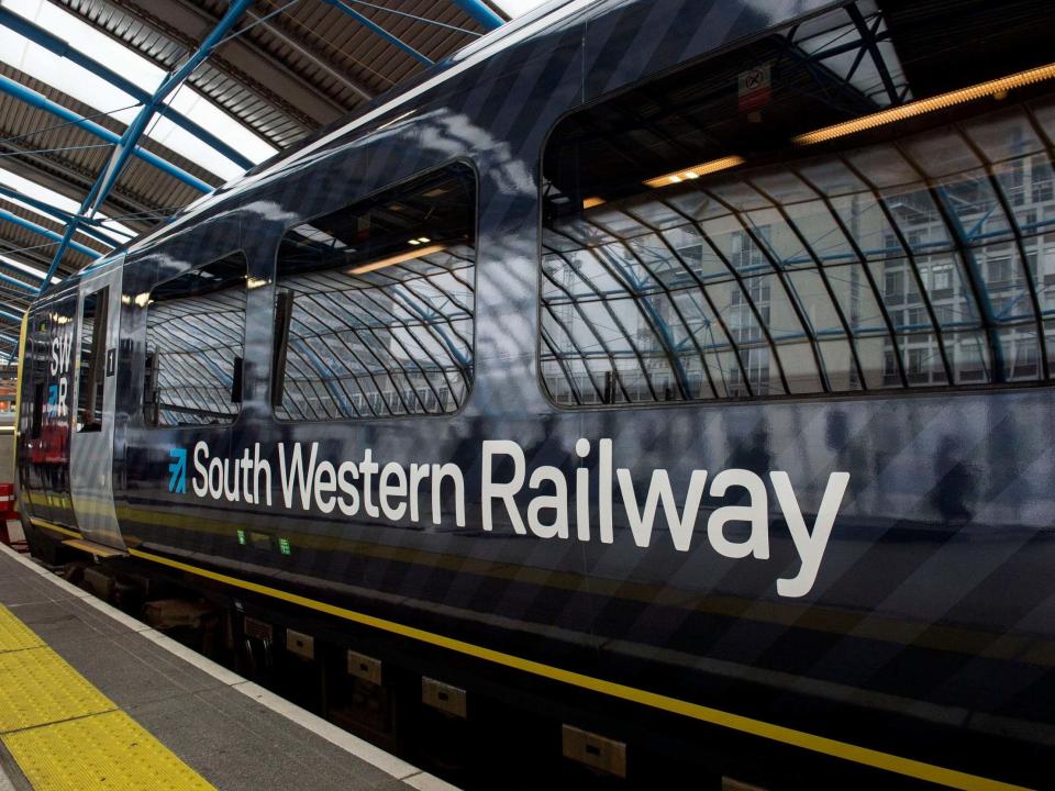 London commuters faced rush-hour misery this morning, as a five-day South Western Railway (SWR) strike kicked off.At one point, a 16-seater minibus was provided as a rail replacement bus service for a 10-carriage train.Images flooded social media of passengers packed onto trains and station platforms, and some pictured snaking down high streets to board trains.SWR workers have walked out from today until 23.59 on 22 June in a long-running dispute about guards on trains. At Surbiton station, passengers shared pictures of people queueing for 200 metres down the high street as they waited to board services.> Train chaos South Western Railway strikes this is the que down Surbiton high street this morning. I’m now back at home chilling out waiting for the dust to settle. pic.twitter.com/0DOzNBoNp2> > — Shaun Ferguson 🇿🇦🇬🇧🏴󠁧󠁢󠁳󠁣󠁴󠁿 (@sferguk) > > June 18, 2019Passengers shared images of empty rails and packed carriages.> Strike week on South Western. pic.twitter.com/8MfsvcSAaf> > — Samuel Gould (@iamsamgould) > > June 18, 2019> Yeah I can’t accept apologies. You are running one bus an hour due to strikes and then can not run that bus but can’t tell anyone and then you think it is safe to allow people to travel like this. This is so unsafe. What about the health and safety of your passengers? pic.twitter.com/NO9jQY2nb0> > — Karlyne Oakes (@KarlyneOakes) > > June 18, 2019One passenger complained that a 16-seater minibus turned up as a replacement bus service.> My replacement bus was a hour late and this is what they sent pic.twitter.com/gw3hl1swXU> > — simon (@aldershot4ever) > > June 18, 2019“We are working with bus operators to provide as many replacement services as possible. In the vast majority of cases, these are single or double deckers,” a South Western Railway spokesperson told The Independent. “In a few instances this has involved using 16 seat coaches to help our passengers complete their journeys. On the few occasions where we use these types of vehicles we try to double up the number.”South Western Railway runs services from London Waterloo to destinations in Surrey, Hampshire, Dorset and Berkshire, with London commuters heavily affected. Travellers to Royal Ascot, which starts today, will also be affected.A reduced service will run on most of the network for the next five days. Some routes will not have any trains, nor run a rail replacement service. SWR says it has laid on extra trains to cope with Ascot demand, although it advises passengers to leave extra time to board services.The strike has been called by the National Union of Rail, Maritime and Transport Workers (RMT).