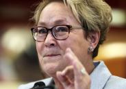 Parti Quebecois leader Pauline Marois gestures as she speaks following a tour of a children's indoor play centre in Blainville, Quebec March 25, 2014. The governing separatist Parti Quebecois would lose next month's Quebec provincial election if it were held now, a poll released on Tuesday showed, a casualty of renewed concentration during the campaign on the issue of independence from Canada. REUTERS/Christinne Muschi (CANADA - Tags: POLITICS)