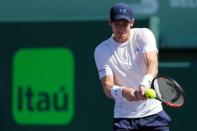 Andy Murray hits a backhand against Kevin Anderson (not pictured) on day nine of the Miami Open at Crandon Park Tennis Center. Mandatory Credit: Geoff Burke-USA TODAY Sports