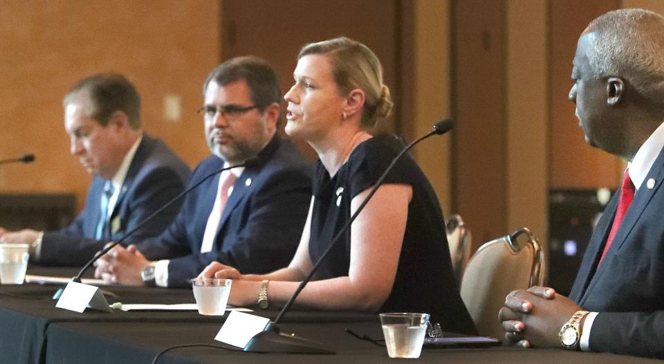 State Rep. Elizabeth Fetterhoff, R-DeLand, speaks at a breakfast with fellow lawmakers, from left, Sen. Tom Wright, Rep. Tom Leek and Rep. Webster Barnaby, on April 14 at Daytona State College.