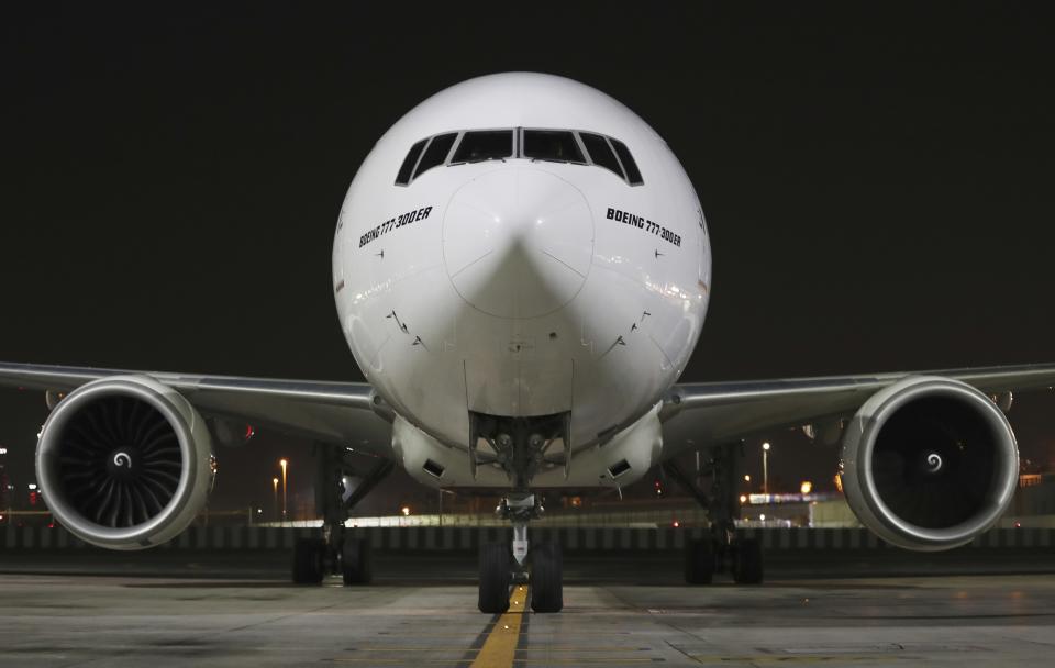 CORRECTS DATE TO EARLY SUNDAY FEB. 21, 2021 - An Emirates Airlines Boing 777 arrives from Brussels to deliver Pfizer-BioNTech COVID-19 coronavirus vaccines shipment at Dubai International Airport in Dubai, United Arab Emirates, early Sunday, Feb. 21, 2021. As the coronavirus pandemic continues to clobber the aviation industry, Emirates Airlines, the Middle East’s biggest airline is seeking to play a vital role in the global vaccine delivery effort. (AP Photo/Kamran Jebreili)