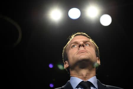 Emmanuel Macron of the political movement En Marche ! (Onwards !) arrives at the television studio where the eleven candidates will attend a prime-time televised debate for the French 2017 presidential election in La Plaine Saint-Denis, near Paris, France, April 4, 2017. REUTERS/Lionel Bonaventure/Pool