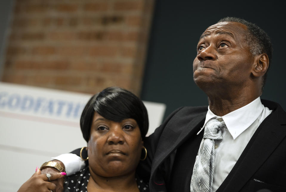 Jackie Wilson, with his wife, Sandra Wilson, listens during a news conference at the offices of Loevy & Loevy Attorneys at Law in Chicago, Wednesday, June 30, 2021. Wilson, a victim of torture by Chicago police officers under the command of convicted perjurer Jon Burge, has filed a federal lawsuit against city officials and Cook County prosecutors. (E. Jason Wambsgans/Chicago Tribune via AP)