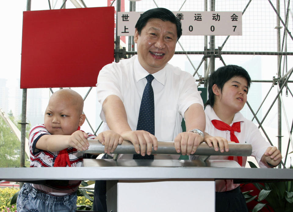 FILE - Xi Jinping, then Shanghai's Communist Party chief, attends a ceremony to launch the countdown clock for the Shanghai Special Olympic Games in Shanghai, China, on June 24, 2007. Chinese President Xi Jinping was the son of a communist revolutionary leader, a victim of the Cultural Revolution and a provincial leader who promoted economic growth before ascending to the very top a decade ago. (AP Photo, File)