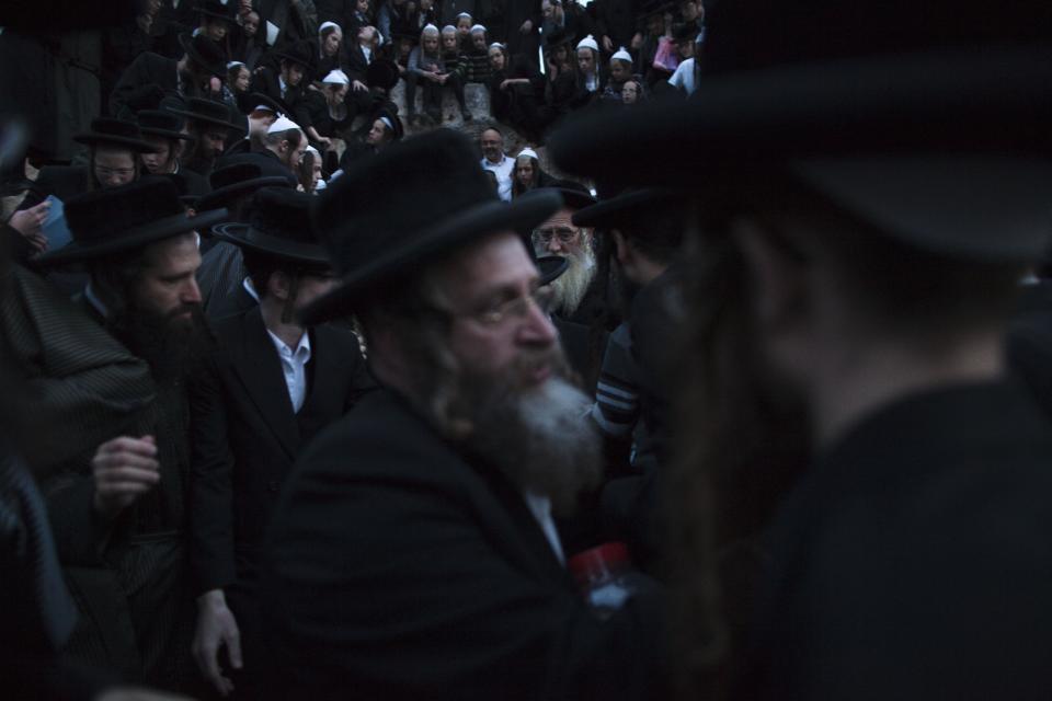 Ultra-Orthodox Jews collect water to make matza during the Maim Shelanoo ceremony at a mountain spring, near Jerusalem, Sunday, April 13, 2014. The water is used to prepare the traditional unleavened bread for the high holiday of Passover which begins Monday.(AP Photo/Dan Balilty)