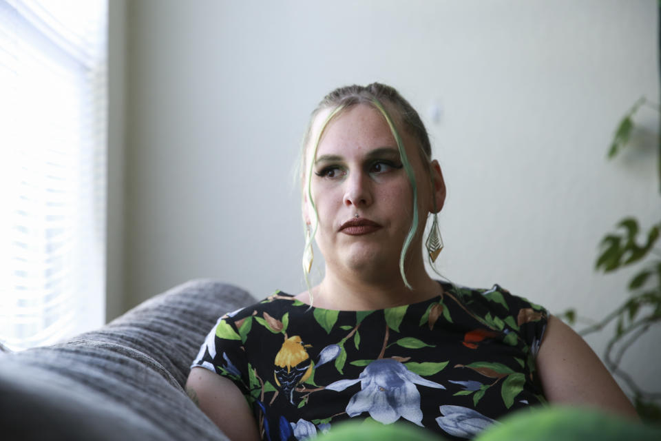 Sage Chelf poses for a photo at her home in Orlando, Fla., May 27, 2023. Recent Florida legislation has caused Chelf, a trans woman, to lose access to her hormone replacement therapy. She's hoping to move to Illinois in the coming weeks to stay with her girlfriend and regain access to care. (AP Photo/Laura Bargfeld)