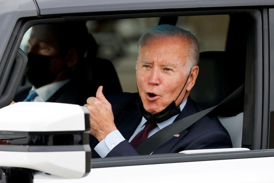 President Biden gestures after driving a Hummer EV during a tour at the General Motors 'Factory ZERO' electric vehicle assembly plant in Detroit, November 17, 2021. REUTERS/Jonathan Ernst