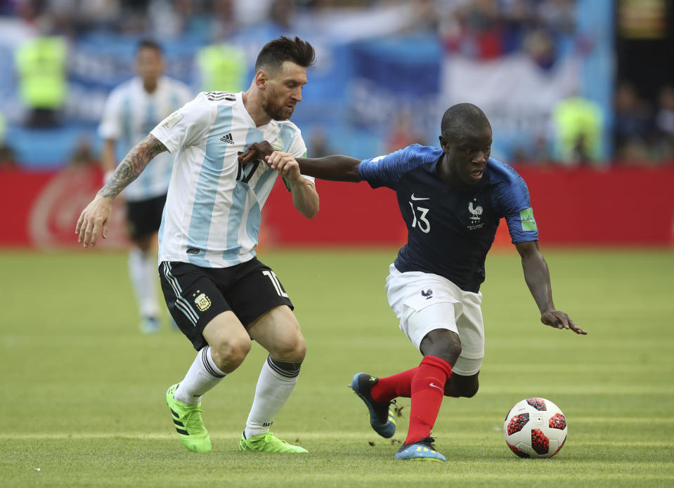 FILE - France's Ngolo Kante, right, fends off a challenge from Argentina's Lionel Messi during the round of 16 match between France and Argentina, at the 2018 soccer World Cup at the Kazan Arena in Kazan, Russia, Saturday, June 30, 2018. (AP Photo/Thanassis Stavrakis, File)
