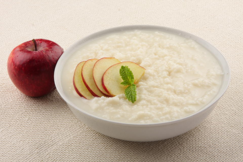 Homemade rice pudding with milk and apples.