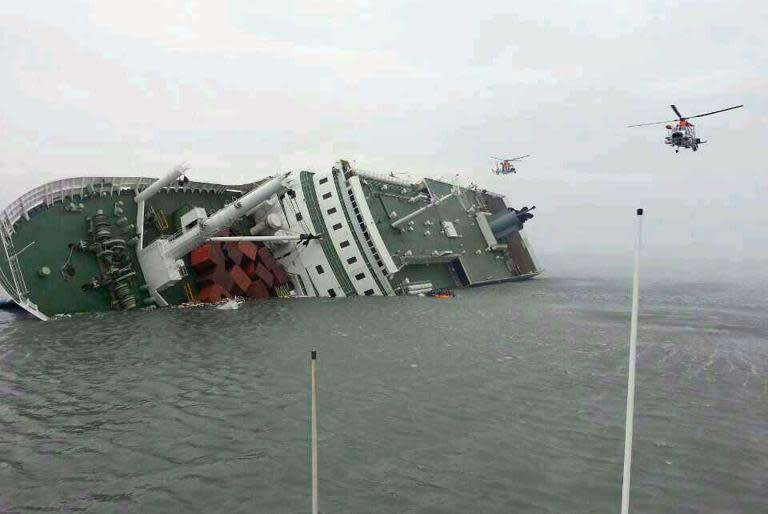 Helicopters rush to aid 477 passengers and crew aboard this sinking South Korean ferry some 20 kilometres off the island of Byungpoong in Jindo, as shown in this South Korea Coast Guard photo from April 16, 2014