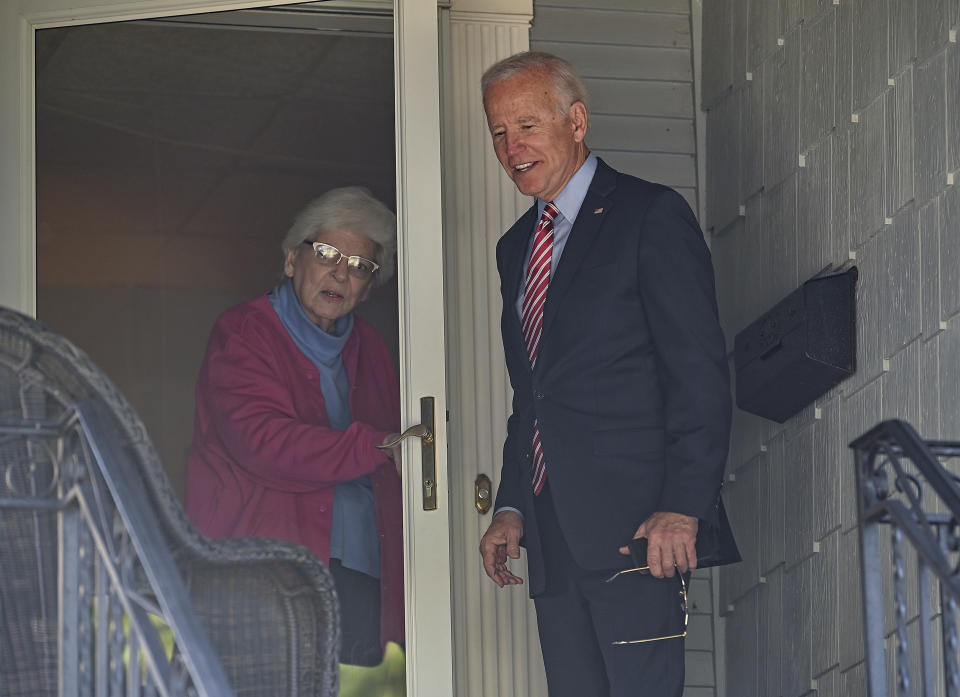 Former U.S. Vice President Joe Biden makes a stop to see Anne Kearns who lives in his childhood home in Scranton Pa., on Wednesday, Oct. 23, 2019. (Jason Farmer/The Times-Tribune via AP)