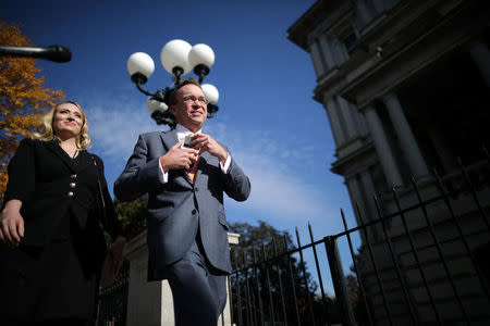 Office of Management and Budget Director Mick Mulvaney leaves the Consumer Financial Protection Bureau (CFPB) building after a meeting in downtown Washington D.C., U.S. November 27, 2017. REUTERS/Carlos Barria