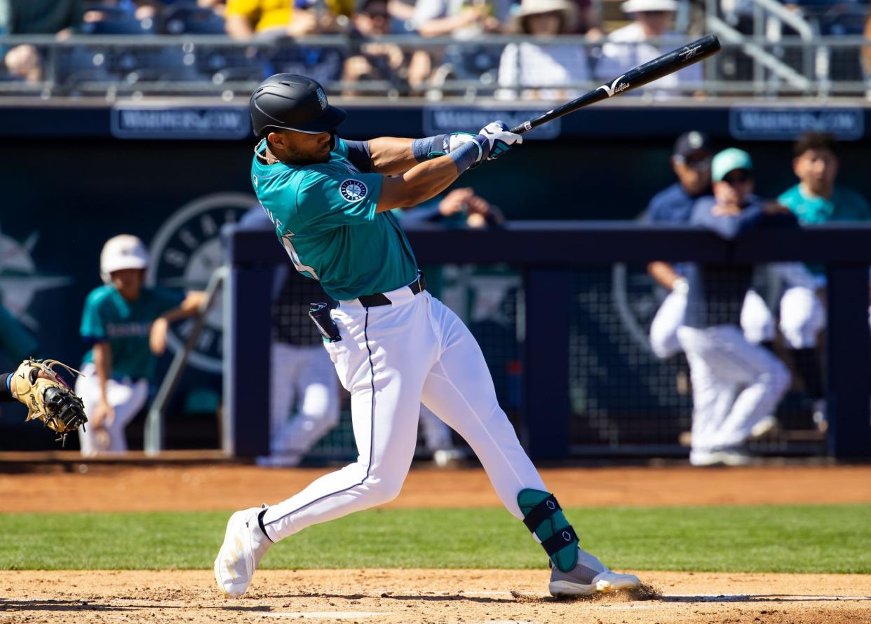 After hitting 32 homers and stealing 37 bases in his age-22 season, the Mariners' Julio Rodriguez is the top-ranked fantasy outfielder in the American League entering 2024.