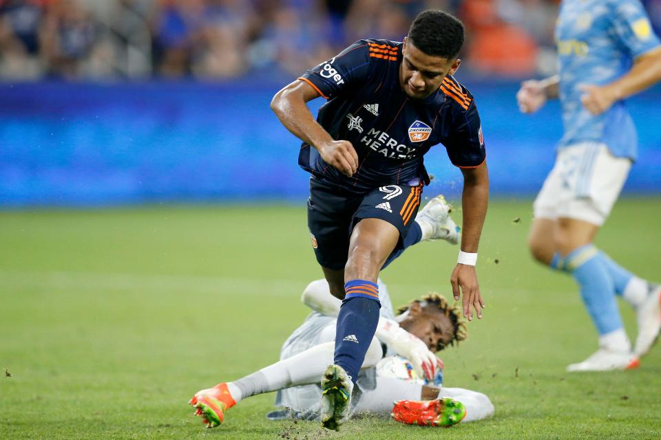 Philadelphia Union goalkeeper Andre Blake (18) swipes the ball away from FC Cincinnati forward Brenner (9) in the second half of the MLS match between FC Cincinnati and Philadelphia Union at TQL Stadium in Cincinnati on Saturday, Aug. 6, 2022. FC Cincinnati scored three goals in the second half for a 3-1 win over Philadelphia. 