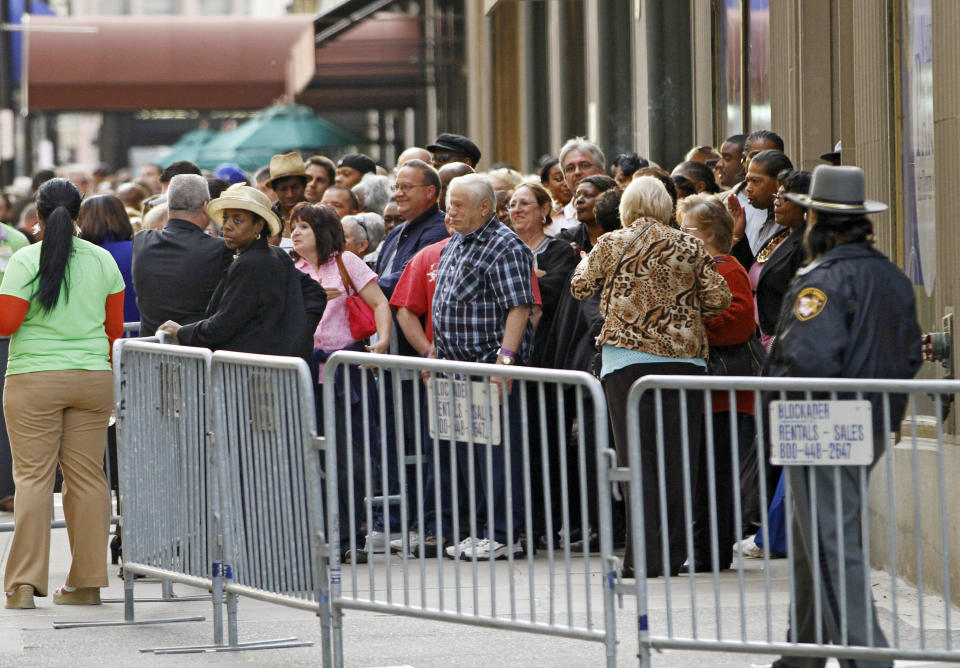 FILE - In this Monday May 14, 2012 file photo, visitors line up outside the Horseshoe Casino Cleveland waiting for the 9:30 p.m. opening of Ohio's first casino. Ohio's entry into casino gambling this spring isn't good news for its neighboring states. States including Indiana, Michigan and Pennsylvania are likely to lose millions in tax revenues as more Ohioans stay home to gamble. That could mean less money for new schools, college scholarships, roads and bridges. (AP Photo/Mark Duncan)