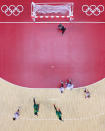 <p>Bruna de Paula (R) of Team Brazil shoots and scores during the Women's Preliminary Round Group B match between ROC and Brazil on day two of the Tokyo 2020 Olympic Games at Yoyogi National Stadium on July 25, 2021 in Tokyo, Japan. (Photo by Dean Mouhtaropoulos/Getty Images)</p> 