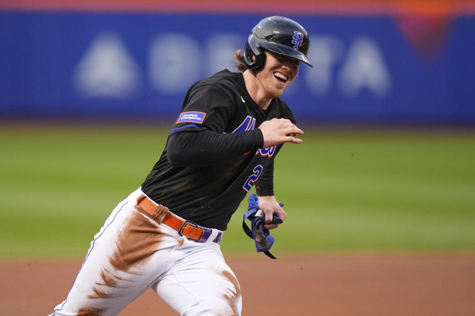 New York Mets' Brett Baty rounds third on the way to scoring on a single by Tommy Pham during the first inning of the team's baseball game against the St. Louis Cardinals on Friday, June 16, 2023, in New York. (AP Photo/Frank Franklin II)