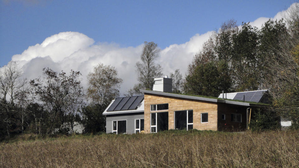 This image released by Acorn Art and Photography shows the Solterre Concept House in Nova Scotia, an off the grid home featured in the book "Downsize, Living Large In a Small House" by Sheri Koones. (Adam Cornick/Acorn Art and Photography via AP)