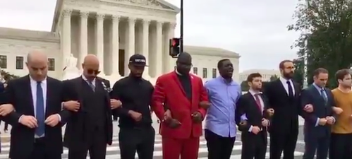 A group of men stood outside of the Supreme Court to oppose Judge Kavanaugh’s nomination. (Photo: Twitter)