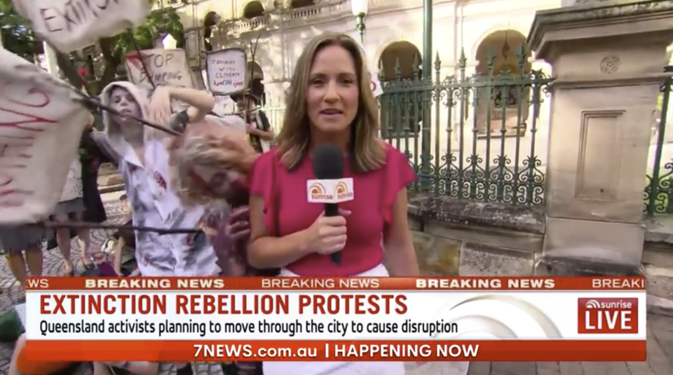 Queensland correspondent Bianca Stone was covering the climate change protest when the the zombies, who are part of the group Extinction Rebellion, began interrupting her cross. Photo: Seven