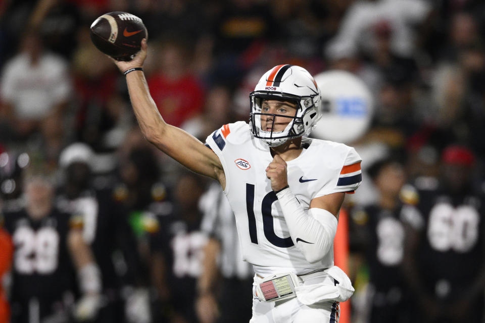 Virginia quarterback Anthony Colandrea (10) throws a pass during the first half of the team's NCAA college football game against Maryland, Friday, Sept. 15, 2023, in College Park, Md. (AP Photo/Nick Wass)