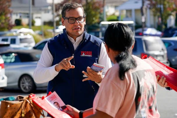 PHOTO: Republican candidate for New York's 3rd Congressional District George Santos, talks to a voter while campaigning, Nov. 5, 2022, in Glen Cove, New York. (Mary Altaffer/AP, File)